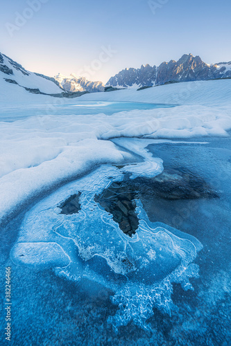 Icy surface of Forbici Lake due to spring thaw, Valmalenco, Valtellina, Sondrio province, Lombardy photo