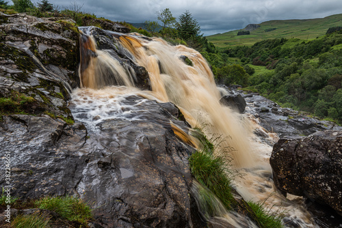 The Loup of Fintry waterfall on the River Endrick, located approximately two miles from Fintry village, near Stirling, Scotland photo