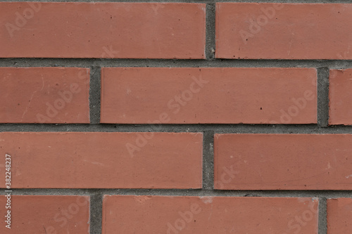 pattern stone wall dark red brick with cement lines background base solid