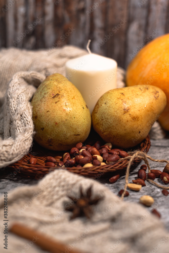 cozy autumn. candle, cinnamon, pear, anise, nuts on white knitted sweater. Hygge lifestyle. cozy autumn. candle, cinnamon, pear, anise, nuts on white knitted sweater. Hygge lifestyle.