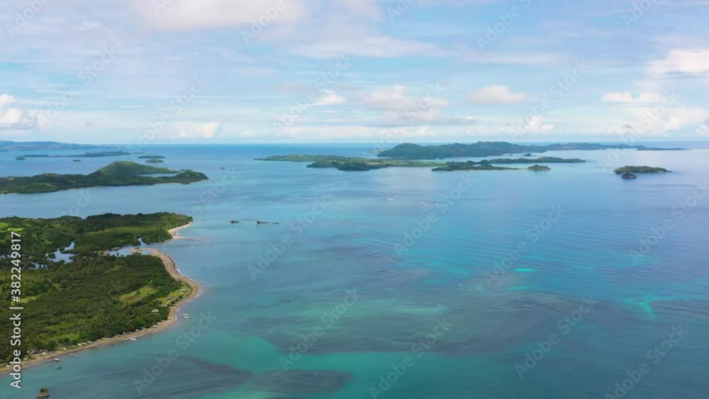 Seascape with islands in the early morning, aerial view. Caramoan Islands, Philippines. Summer and travel vacation concept. Seascape with islands in the early morning, aerial view. Caramoan Islands, Philippines. Summer and travel vacation concept.