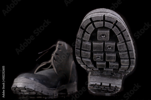 Work shoes with visible sole and tread. Footwear for a production worker.