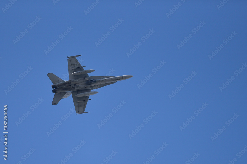 Military jet flying on a blue sky Military jet flying on a blue sky