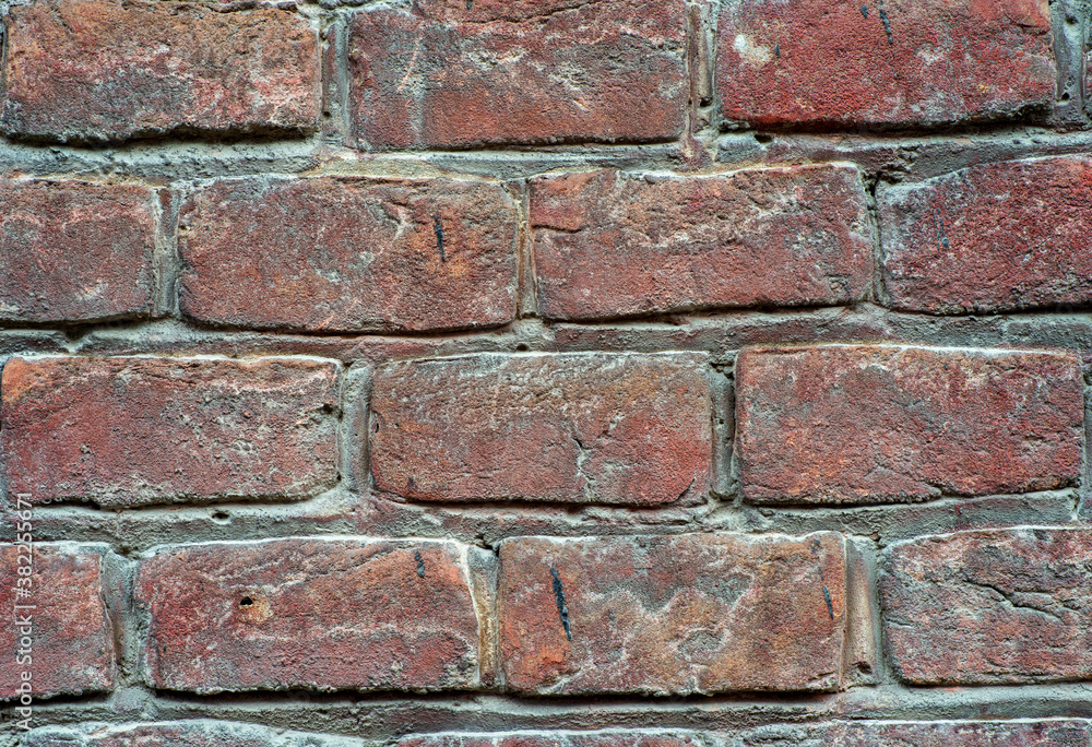 Fototapeta premium the texture of the old wall from red bricks as background