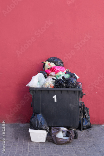 Trash container with colorful background photo