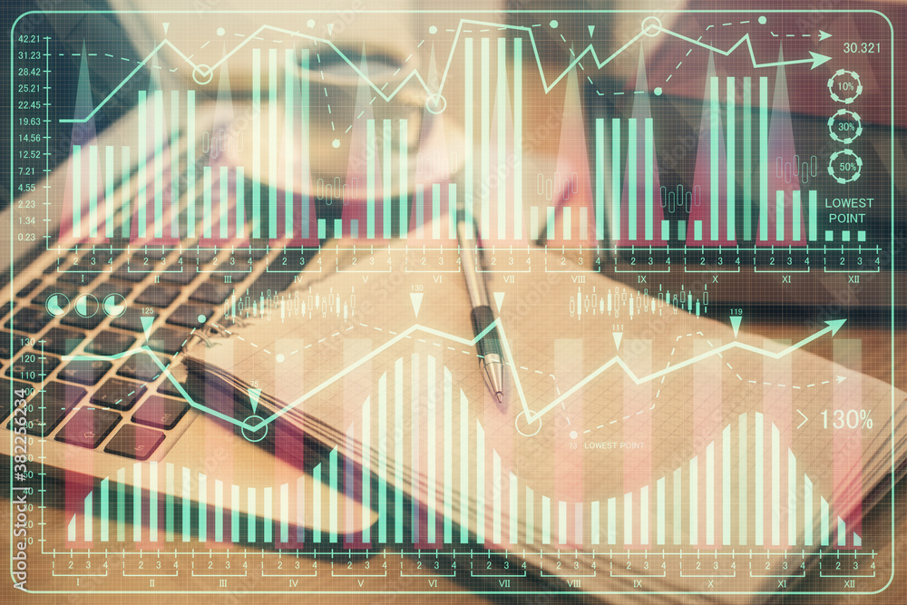 Double exposure of forex chart drawing and desktop with coffee and items on table background. Concept of financial market trading Double exposure of forex chart drawing and desktop with coffee and items on table background. Concept of financial market trading