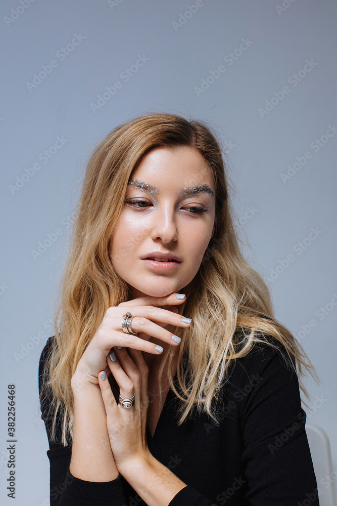 Charming woman in light grey background Charming woman in light grey background