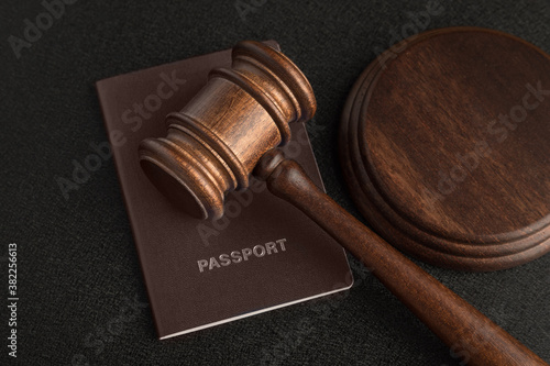 Judge gavel and passport. Obtain citizenship. Corrupt court