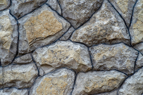 the texture of the old wall from stones as background
