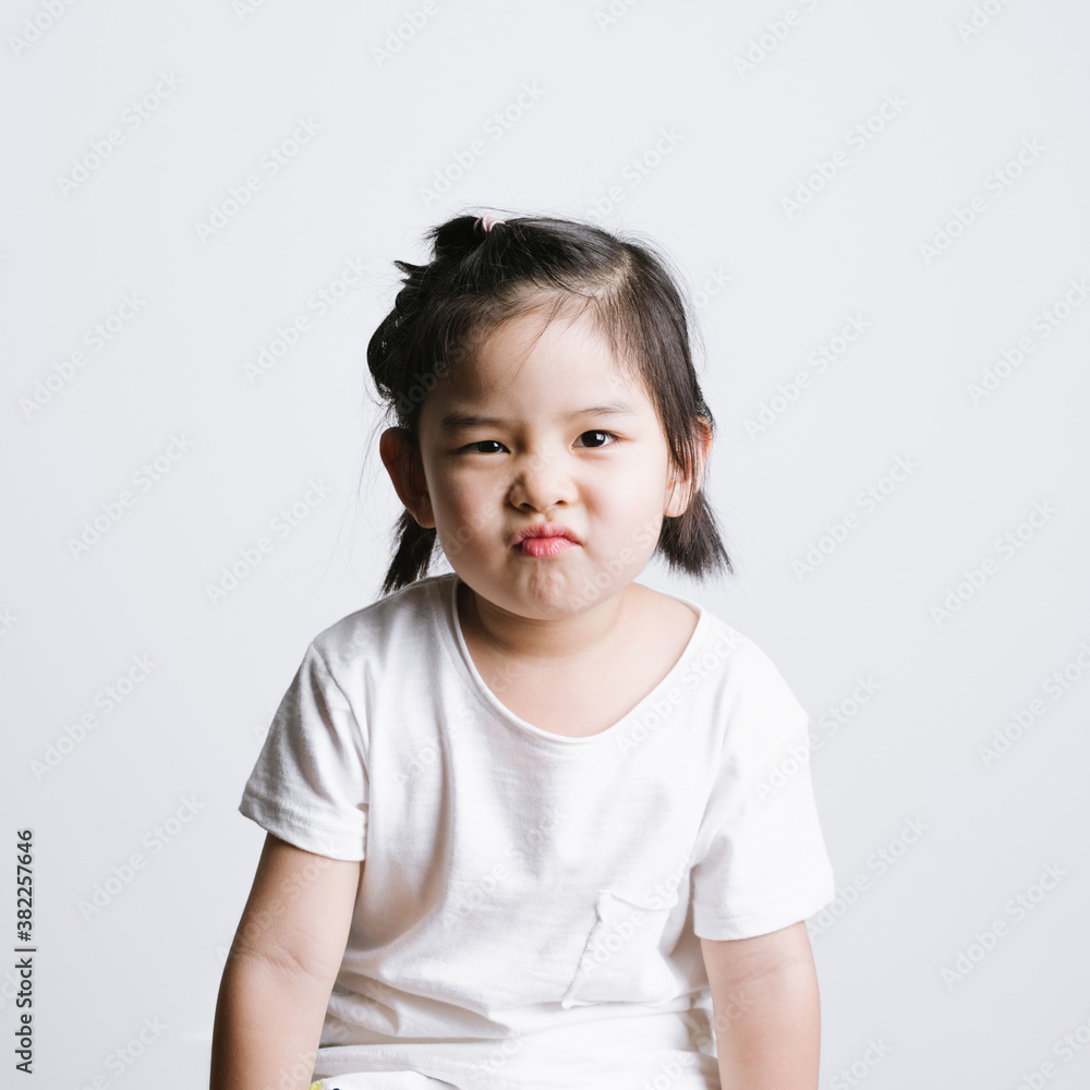 Portrait of cute little girl against white background Portrait of cute little girl against white background