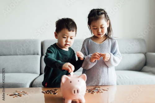 Family saving money in a piggybank