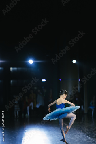 Asian girls perform ballet on stage