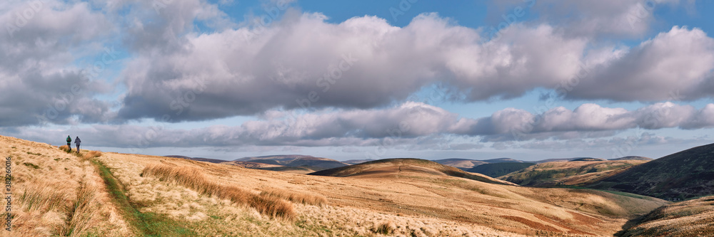 Father and son walking in the Cheviot Hills. Northumberland, UK. Father and son walking in the Cheviot Hills. Northumberland, UK.