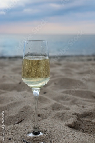 Fototapeta Naklejka Na Ścianę i Meble -  glass of wine on the beach