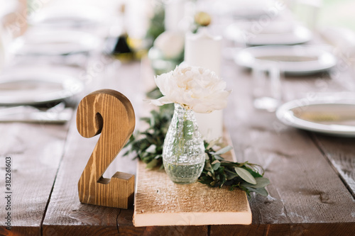 Wooden number 2 on the wedding table photo