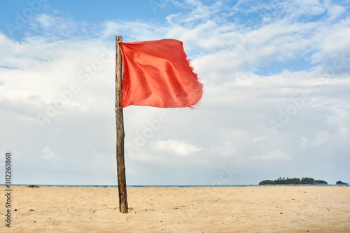Red warning flag on beach