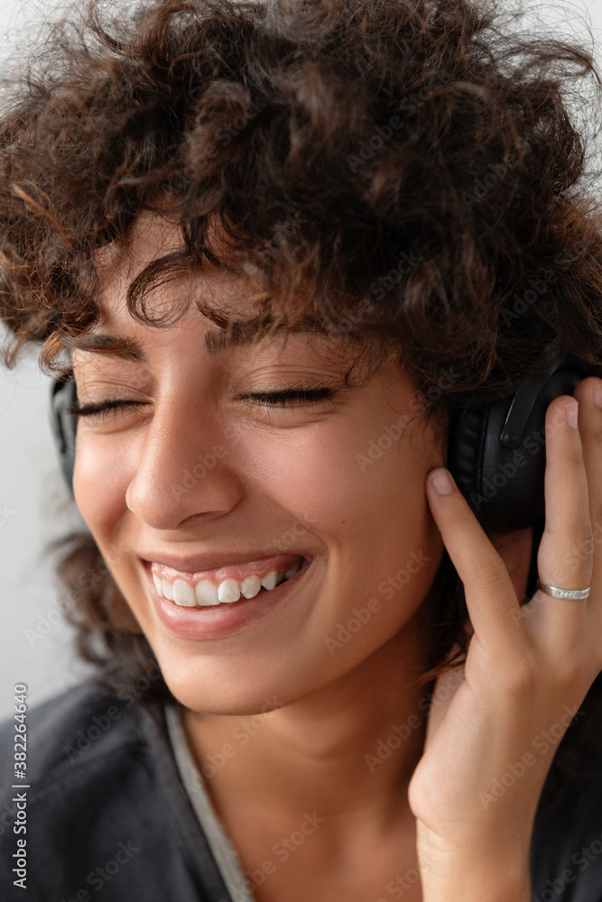 Optimistic woman enjoying good music Optimistic woman enjoying good music