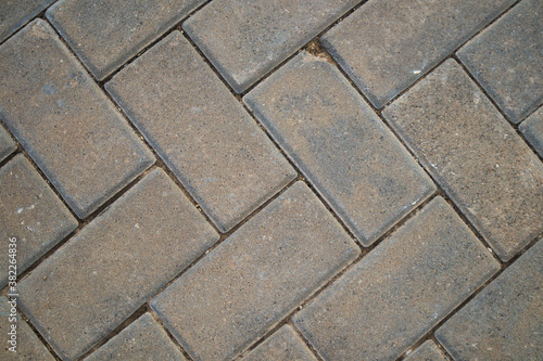 Close-up of the tiles of a gray floor useful for urban backgrounds