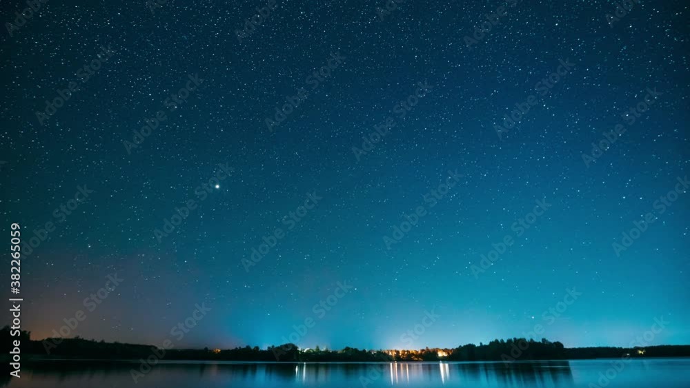 Lyepyel District, Vitebsk Province, Belarus. Real Colorful Night Stars Above Lepel Lake. Natural Starry Sky Background Backdrop Landscape. Time lapse. 4K Lyepyel District, Vitebsk Province, Belarus. Real Colorful Night Stars Above Lepel Lake. Natural Starry Sky Background Backdrop Landscape. Time lapse. 4K
