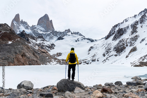 A hiker arrives to the base of Laguna de los Tres in El Chalten, Patagonia, Argentina photo