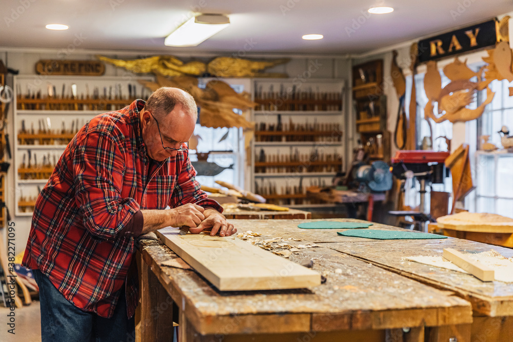 Woodworker at His workshop alone Woodworker at His workshop alone