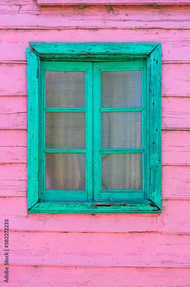 Pink and green window of a facade in Caminito street in Buenos Aires