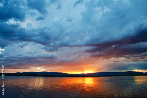 Dramatic clouds over the lake. Sunset. Storm. © photokrle