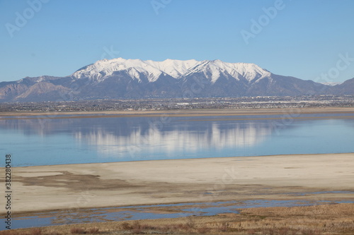 Reflections of Wasatch Mountains in the Great Salt Lake, Antelope Island State Park, Utah photo