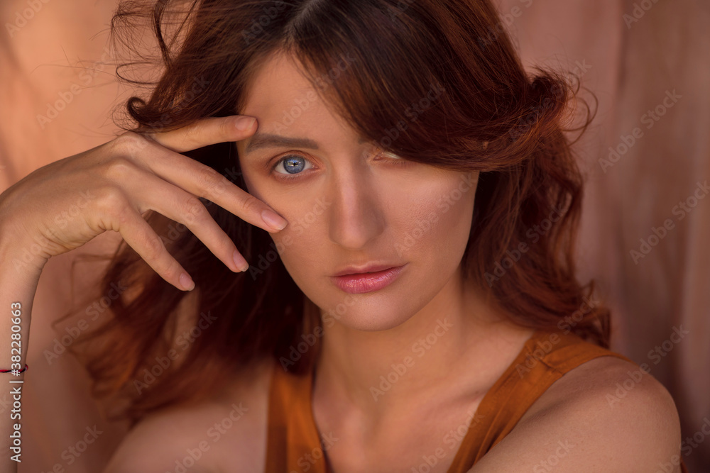 Obraz premium portrait beautiful of a red-haired girl with blue eyes.close up