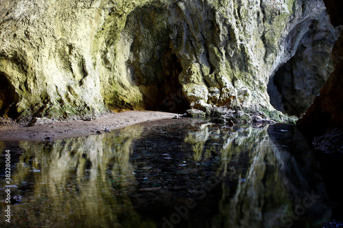 Reflection of rocks in the water in the cave