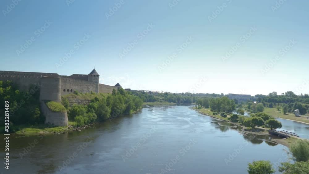 The look of the river and the trees in the border in Narva Estonia The look of the river and the trees in the border in Narva Estonia