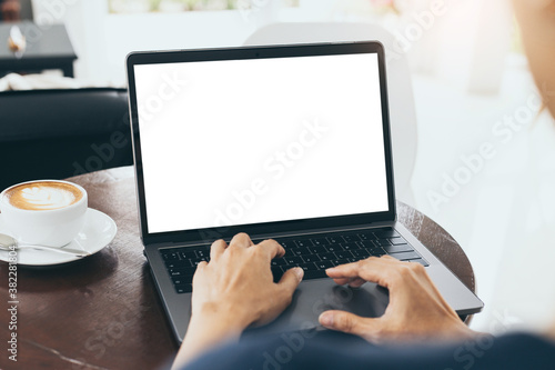 computer mockup blank screen.hand woman work using laptop with white background for advertising,contact business search information on desk at coffee shop.marketing and creative design