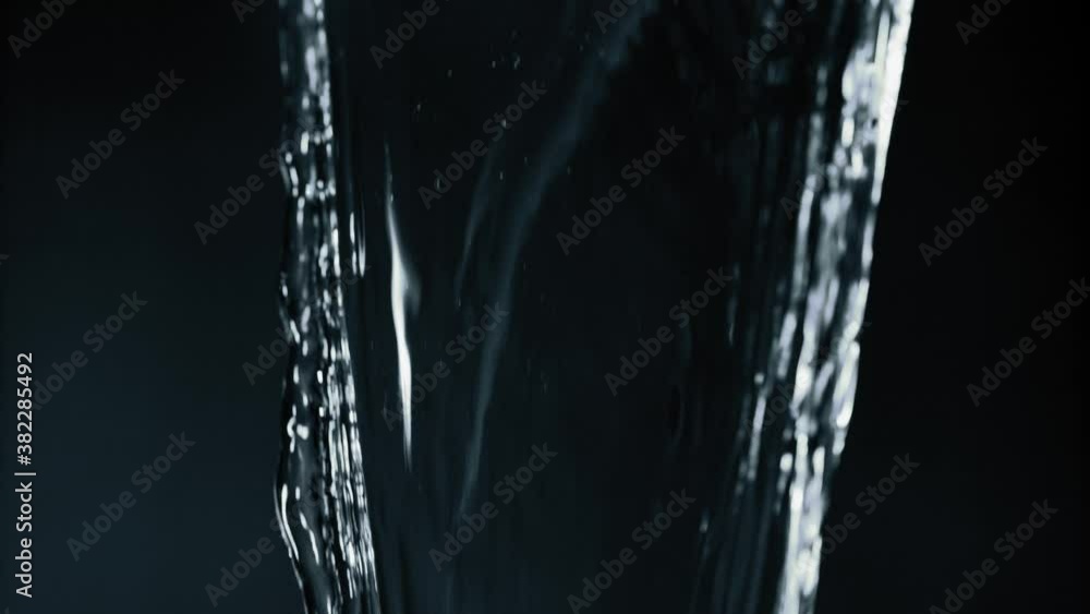 Pouring clear fresh water - slow motion close up Pouring clear fresh water - slow motion close up