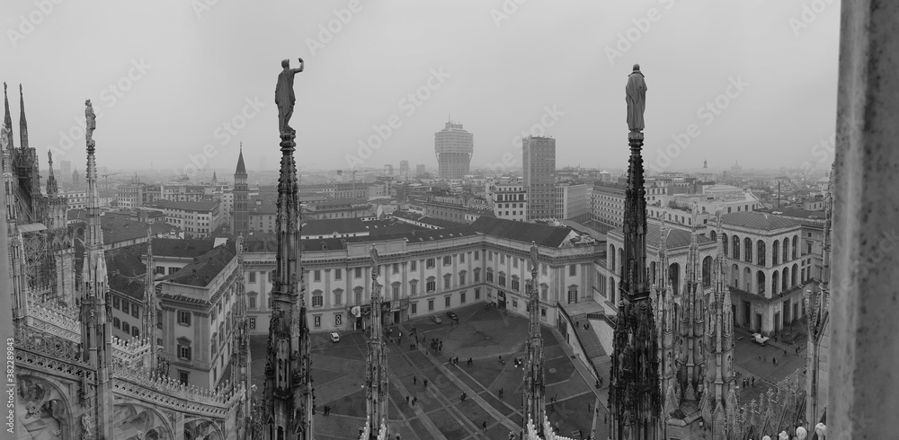 Duomo di Milano. Rooftop terrace on the top of the Duomo. Panorama of Milan Cathedral located in Piazza del Duomo. Italy
