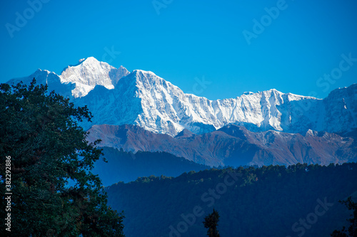 view of kedarnath peak and other peaks from chopta valley of uttarakhand in a october morning photo