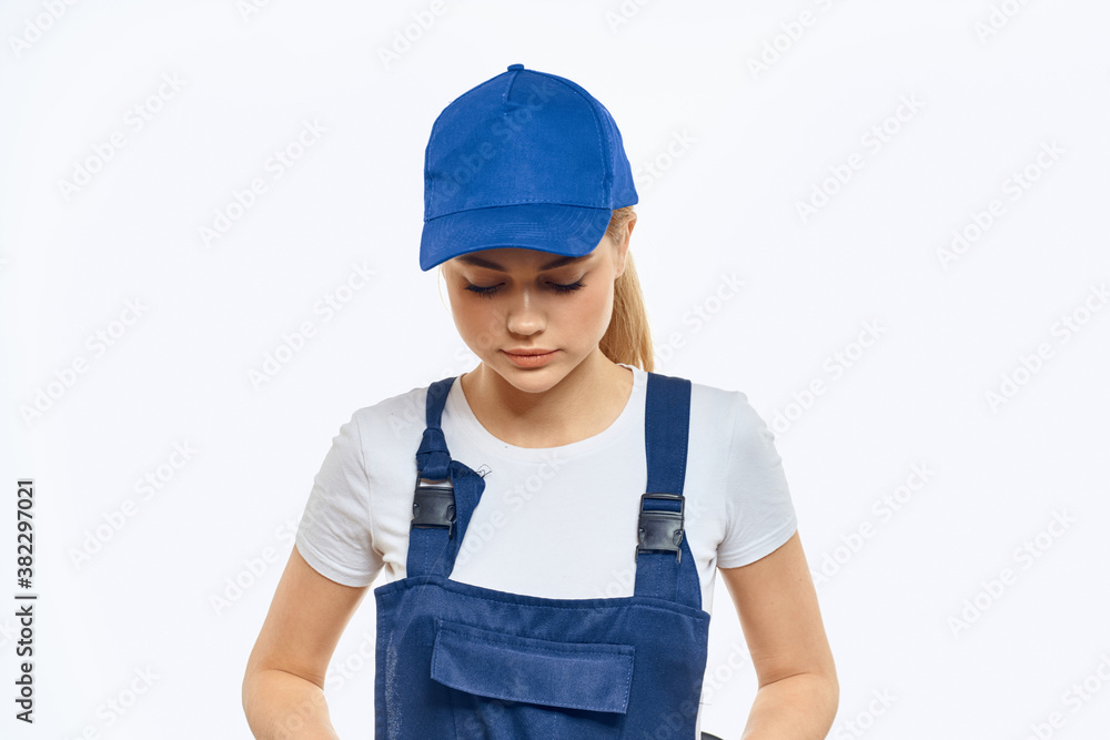 Woman in working uniform blue cap delivery courier delivery service Woman in working uniform blue cap delivery courier delivery service