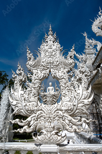 Place of worship, Wat Rong Khun also known as the white temple, located in Chiang Rai Province, Thailand. A unique style Buddhist temple with the bridge of “the cycle of rebirth”