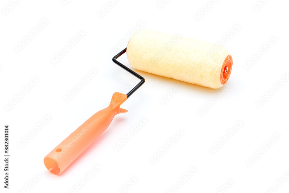 Roller for paint in construction on a white background Roller for paint in construction on a white background