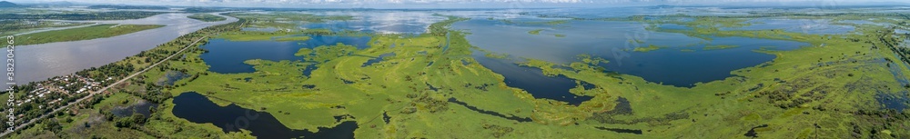 Aerial view panorama of Magdalena River landscape with blue sky and white clouds on a sunny day