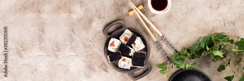 Japanese sushi food. Top view of sushi. Rolls with masaga caviar. Unusual composition of rolls.