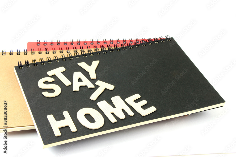 Words stay at home made of wooden blocks, concept of self quarantine work from home Words stay at home made of wooden blocks, concept of self quarantine work from home