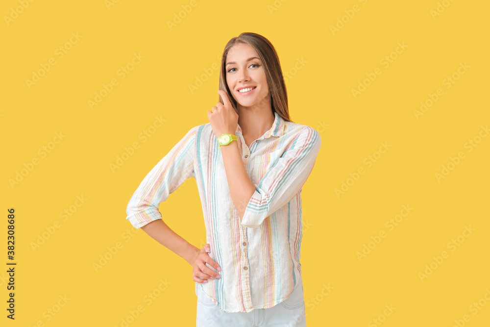 Young woman with wristwatch on color background Young woman with wristwatch on color background
