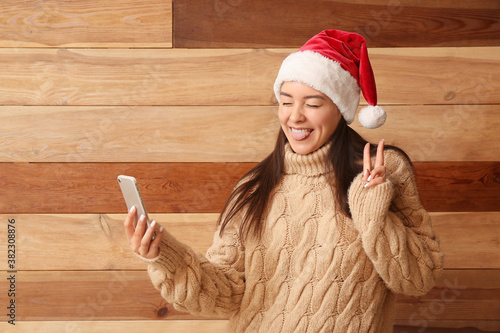 Happy young woman in Santa ...