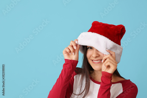 Happy young woman in Santa ...
