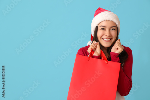 Happy young woman in Santa ...