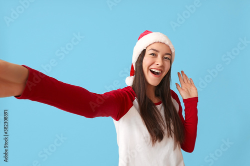 Happy young woman in Santa ...