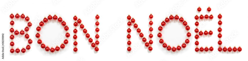 Obraz premium Red Christmas Ball Ornament Building French Word Boen Noel Means Merry Christmas. Festive Christmas Decoration. White Isolated Background