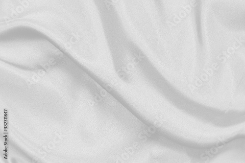 Smooth elegant white silk fabric or satin luxury cloth texture can use as wedding background. for drapery luxurious abstract design