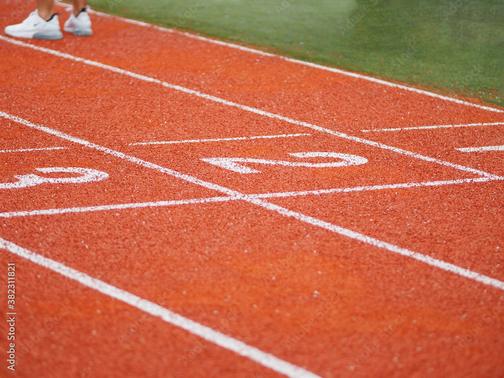 running track on two three number rubber orange color