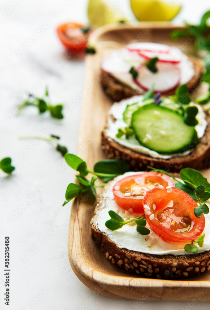 Sandwiches with healthy vegetables and micro greens Sandwiches with healthy vegetables and micro greens